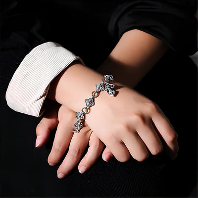 Christianartworkshop Retro - Styled Sterling Silver Cross Bracelet with Floral Motifs: A Nostalgic Sign of Faith